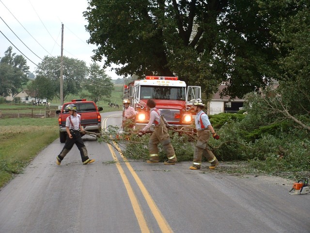 Cleaning a tree off of Cains Road the morning after Hurricane Isabel came though the area; September 2003.